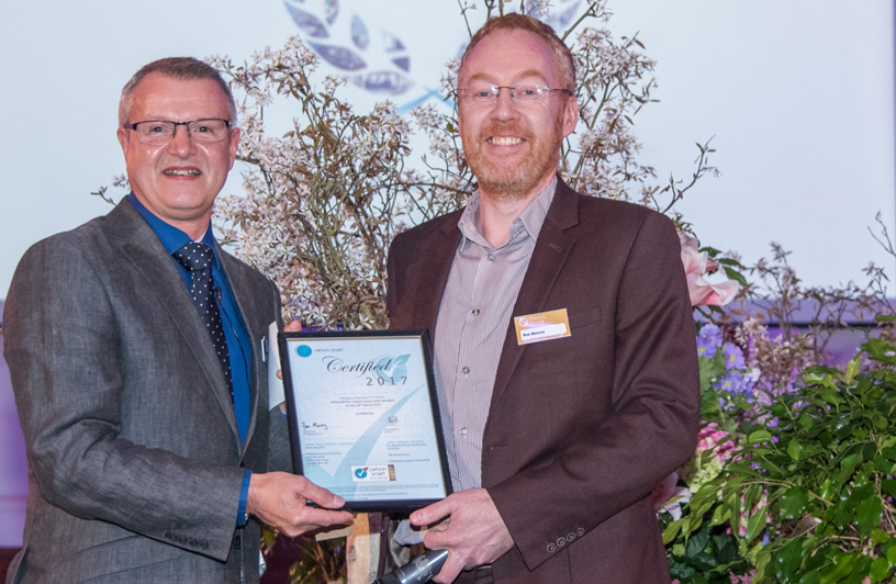 Paul Grey of Friends House Hospitalityreceives award from Ben Murray of CarbonSmart