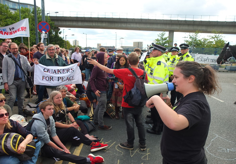 Quaker protesters and police at arms fair