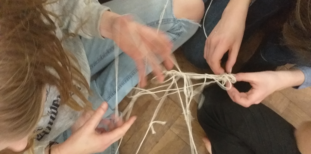 hands connected by string