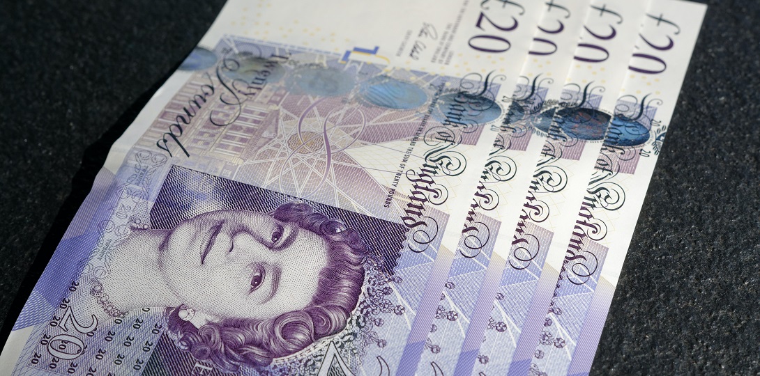 A photograph of several £20 notes