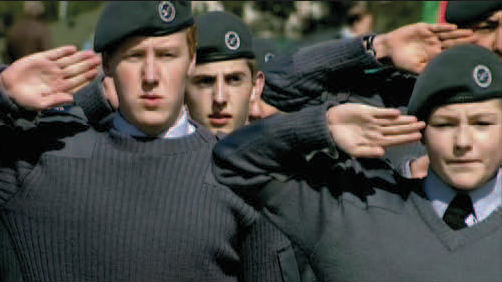 Two young cadets saluting