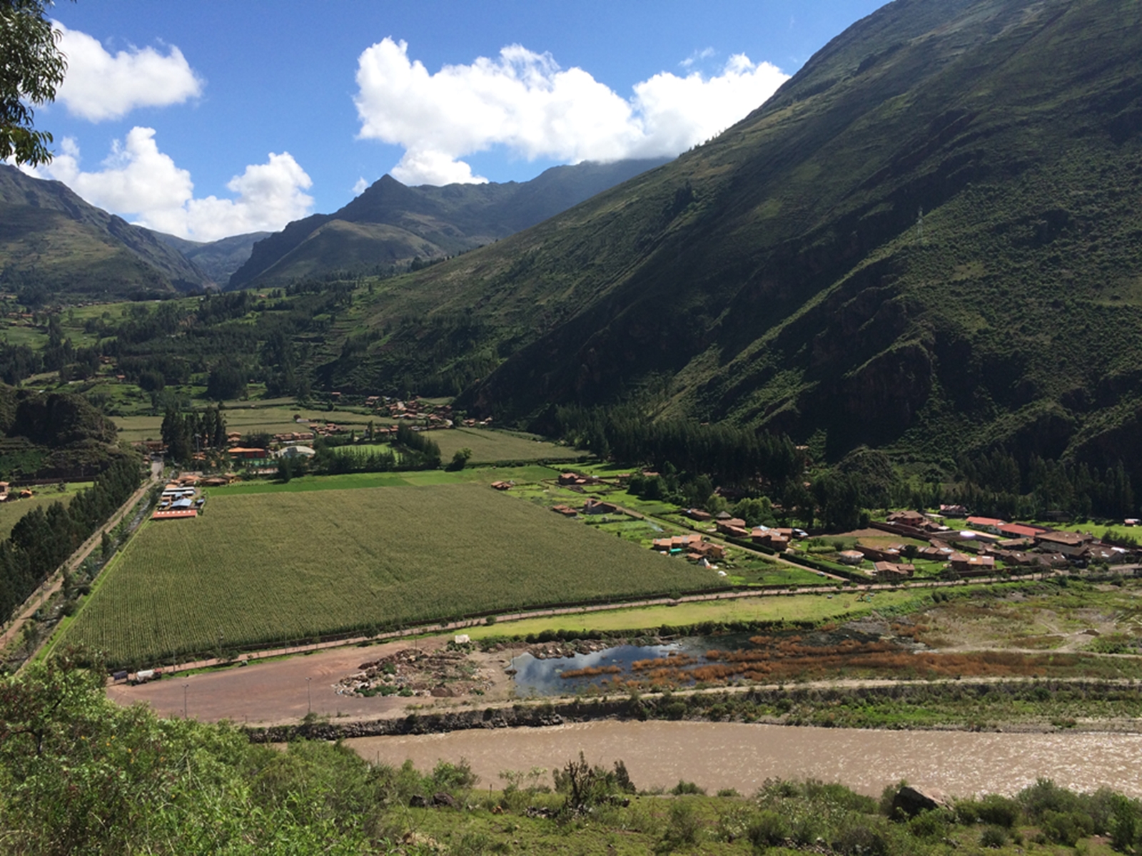 Valley among high mountains, blue sky