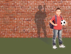 Schoolboy standing with a soldier shadow