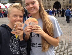 Young people holding Exeter pound notes at the launch