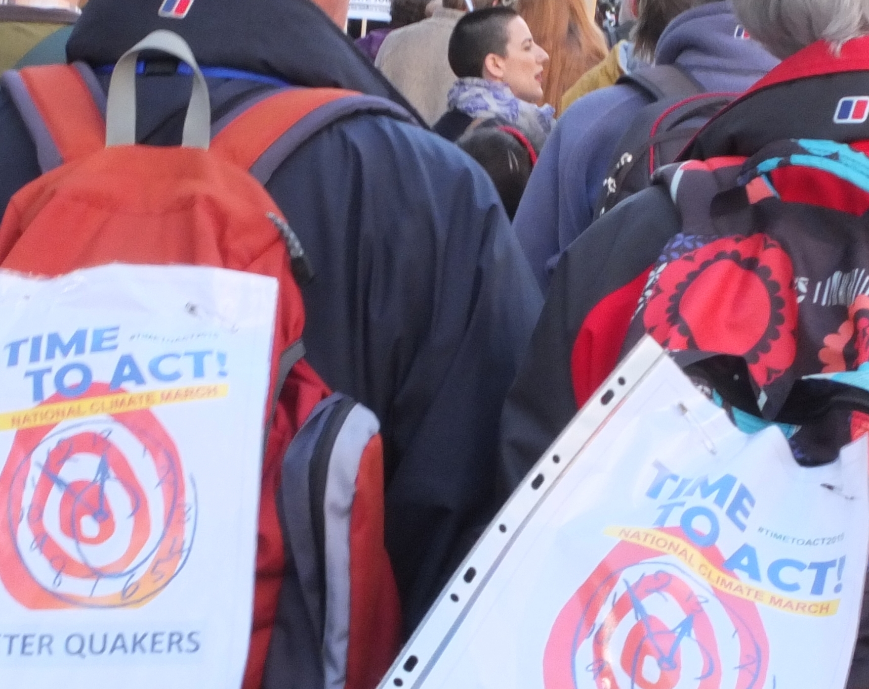 Demonstrators with Time To Act posters