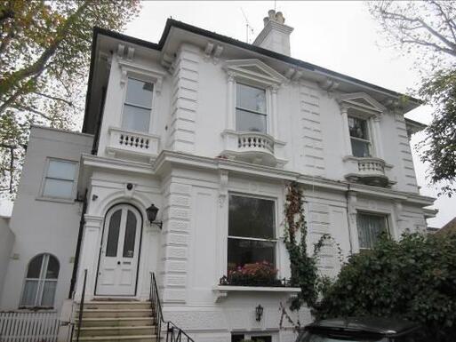 Stuccoed semi-detached house with interesting elevation features.