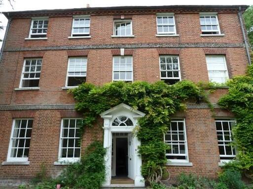 Superior town house lit by huge windows.