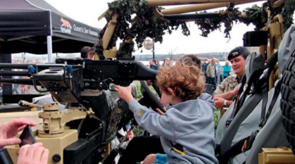 Children playing on military equipment at Liverpool Armed Forces Day, 2017
