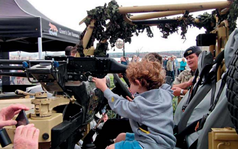 Children playing on military equipment at Liverpool Armed Forces Day, 2017. Photo: John Usher