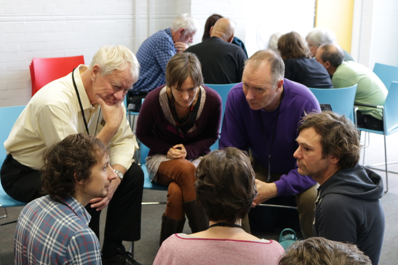 A group discusses fossil fuel extraction