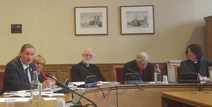 four church figures seated at table plus politician