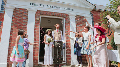 Newlyweds leaving their Quaker wedding ceremony. Photo: Amy Scaife
