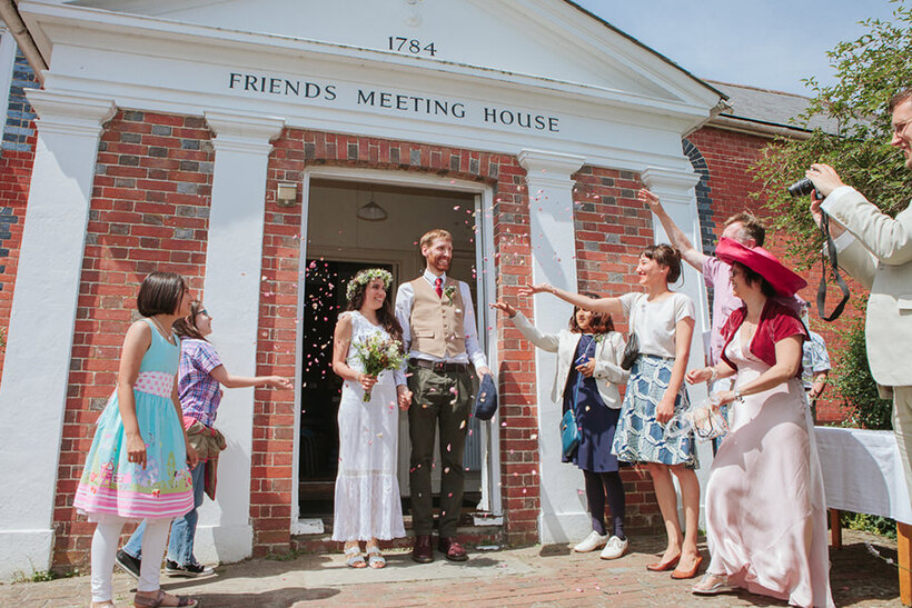 Newlyweds leaving their Quaker wedding ceremony. Photo: Amy Scaife