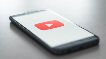 A smartphone loading the YouTube application