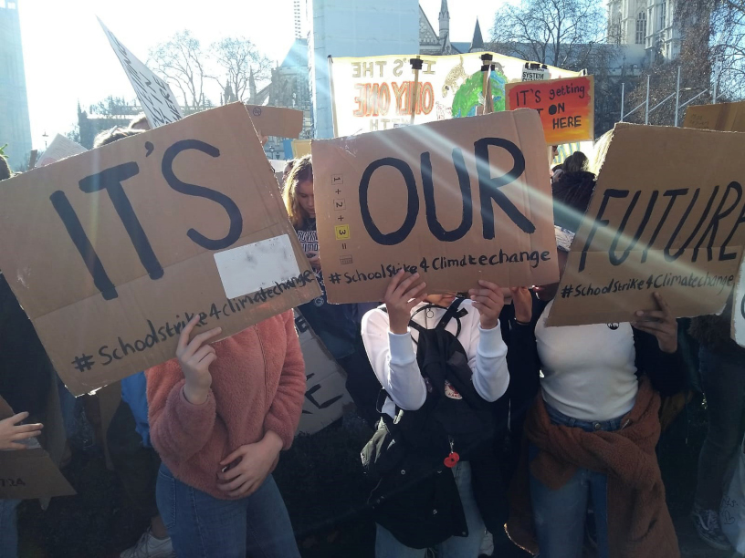 3 placards say its our future