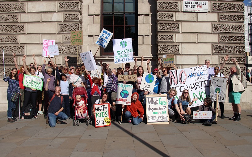 climate strikers with banners at the Treasury