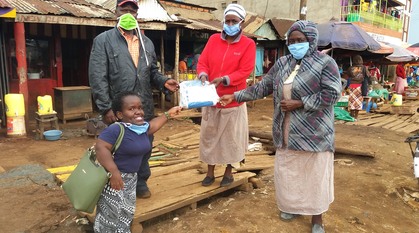 People in a market with face masks