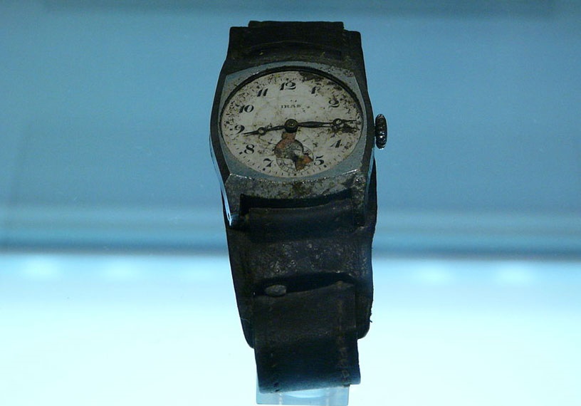 Damaged wristwatch showing 8.15