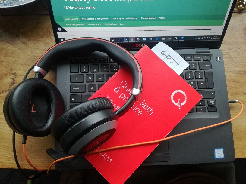 Red Qf&p by laptop and headphones