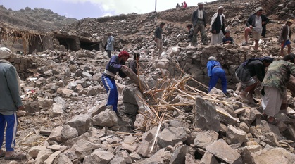 Villagers searching through rubble