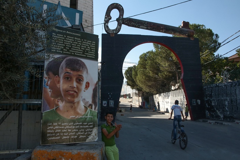 huge poster of child killed by Israeli sniper