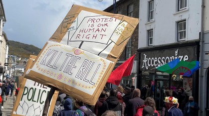 Close up of a protest sign at a 'Kill the Policing Bill rally' down an ordinary high street