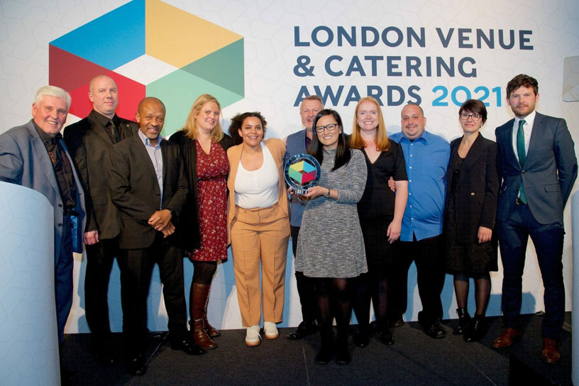 Smiling people receiving award