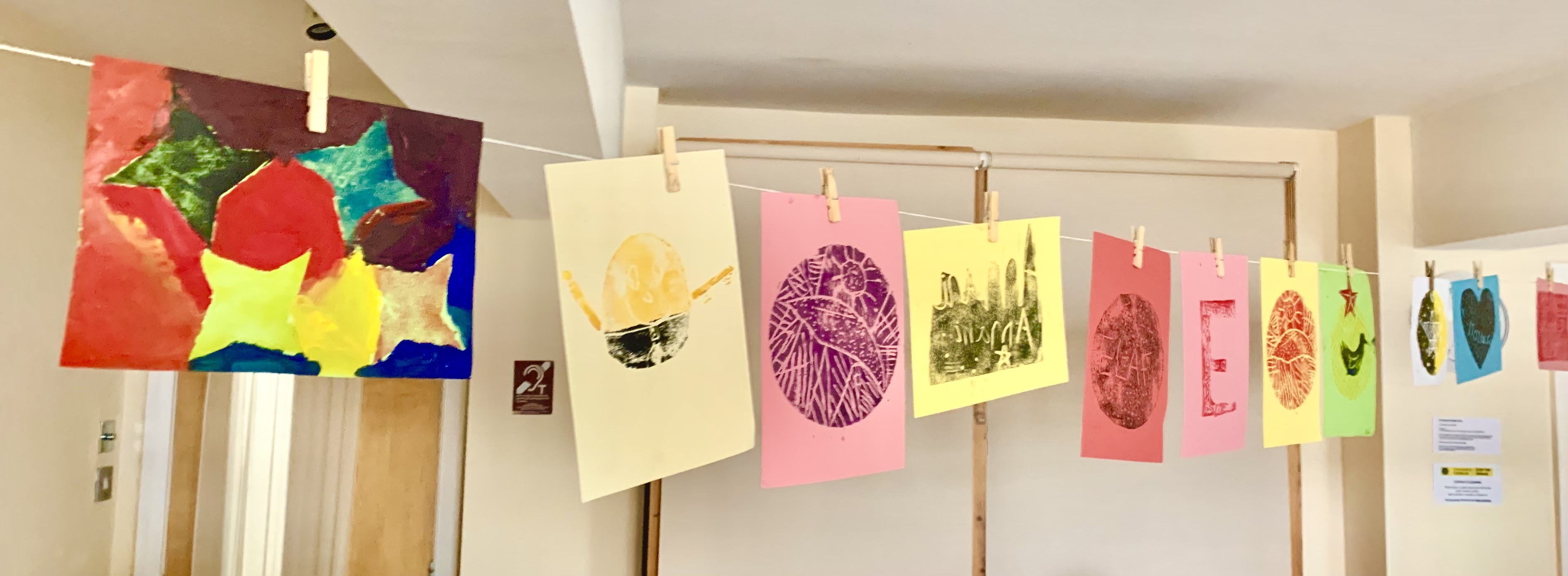 String of colourful prints done by young people