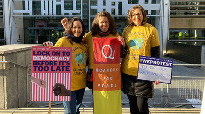 Protesters with Quaker placards