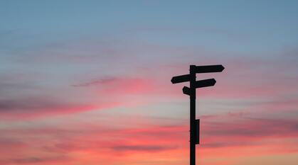Silhouette of a signpost at golden hour