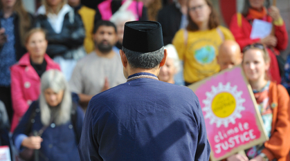 Shanon Shah addressing a crowd on loss and damage action day