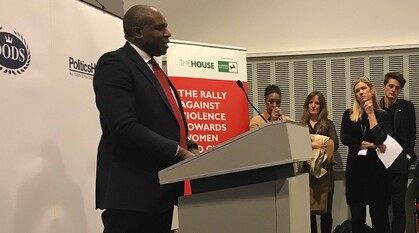 David Lammy MP giving a speech standing at a lectern in a conference meeting room