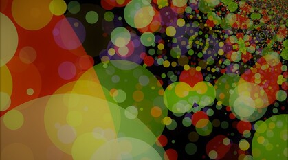 abstract image of circles in mainly red yellow and green on a black background