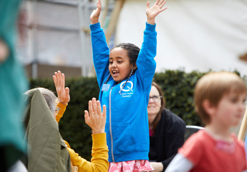 Child with arms in air