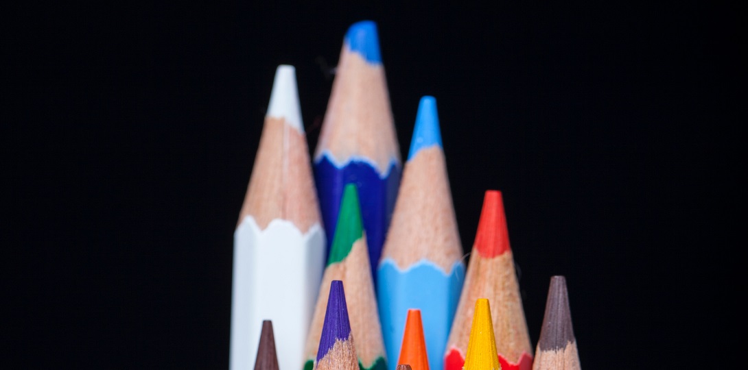 A stack of coloured pencils of different heights