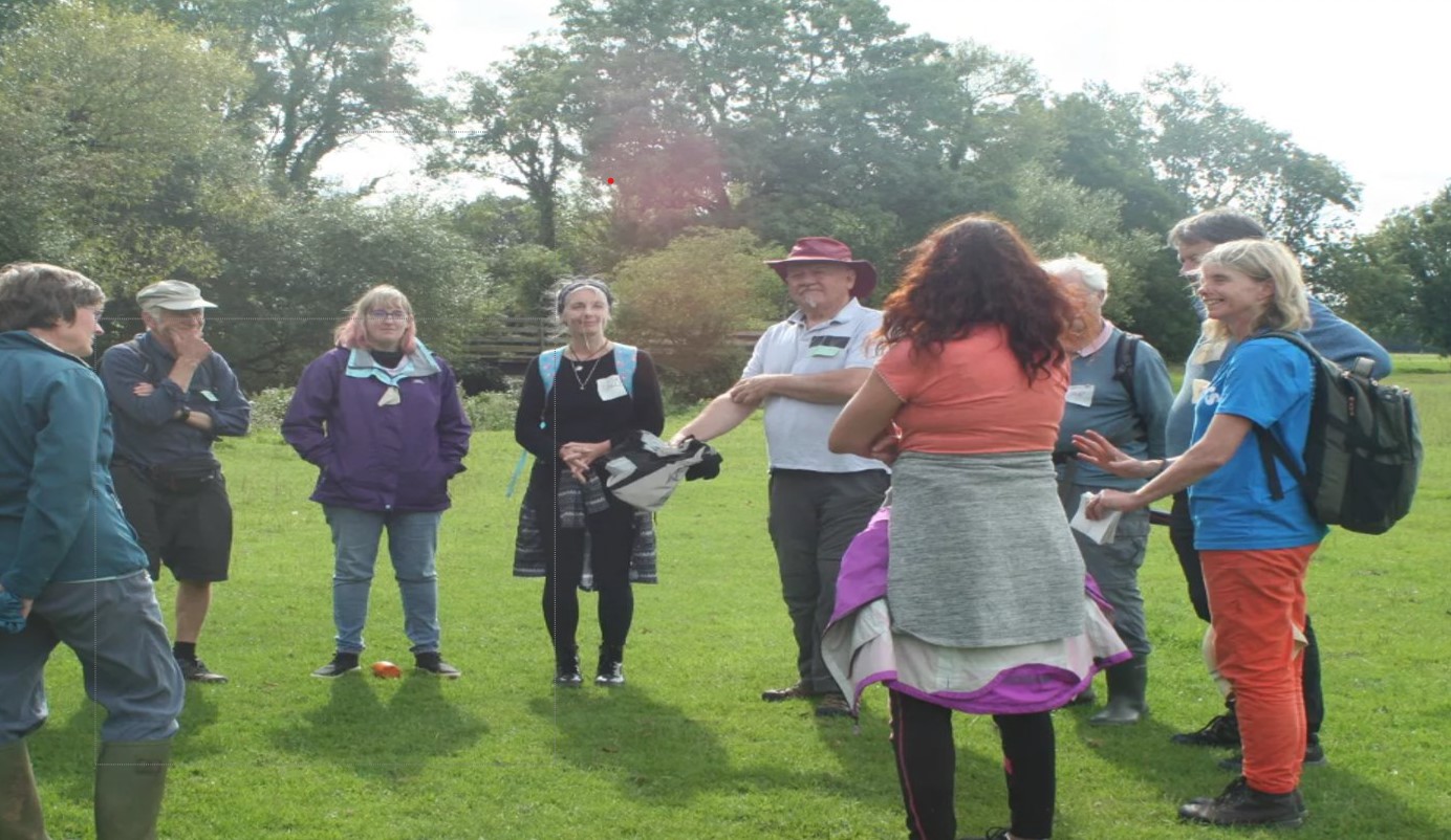 people standing in a circle outside