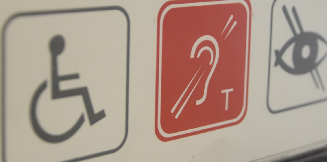 A sign with different disability logos