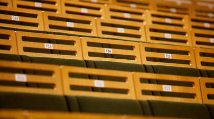 Numbered chair in tiered seating in the Large Meeting House