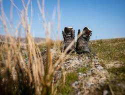 A pair of walking boots in the mountains