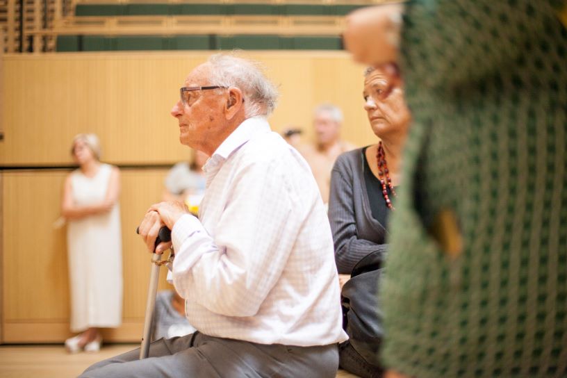 Seated man listening