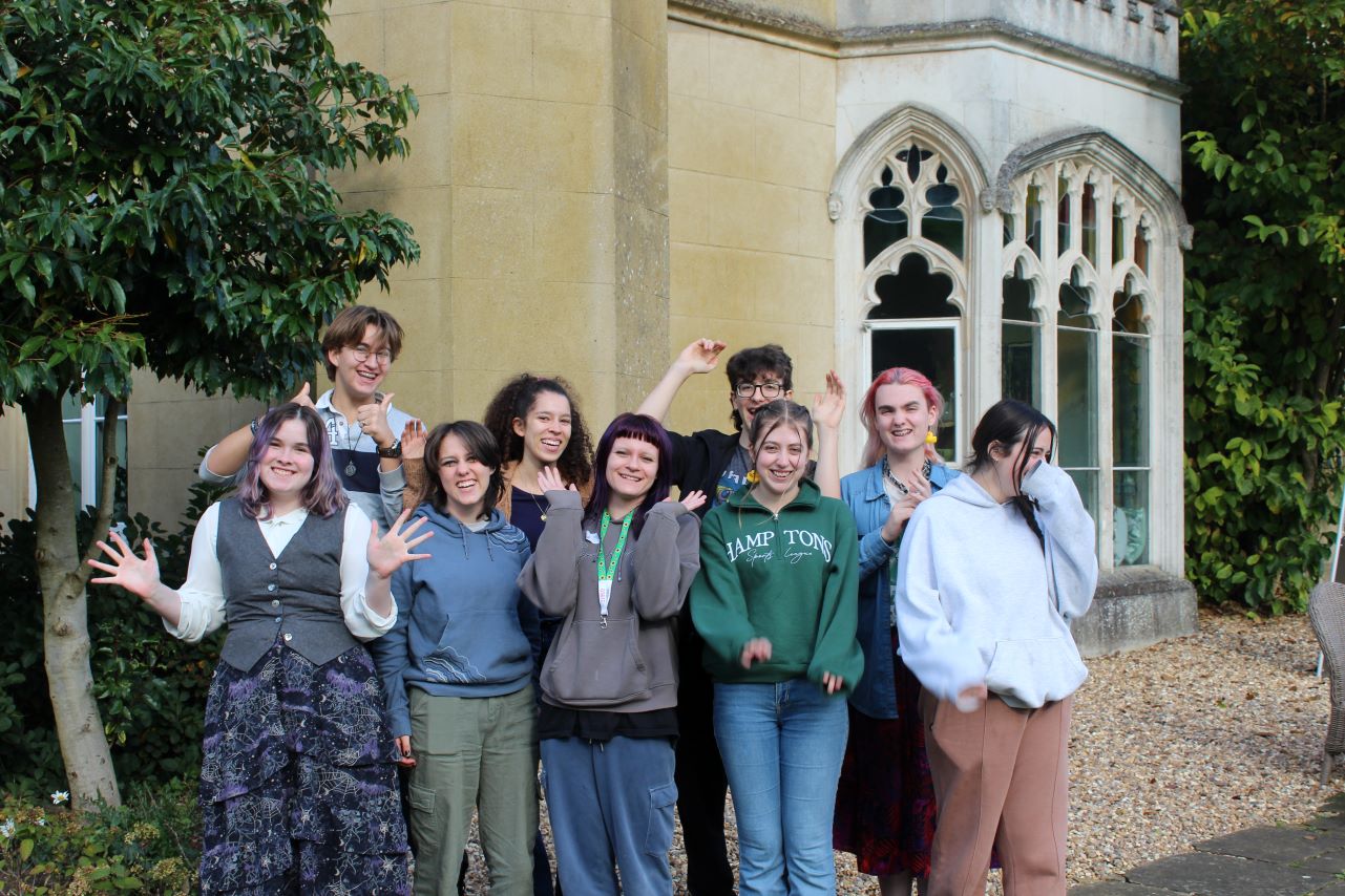 group of teenagers in front of building