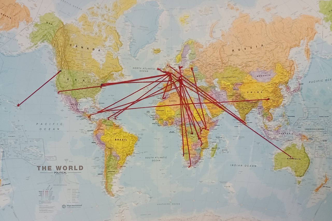 map of world with red lines connecting countries