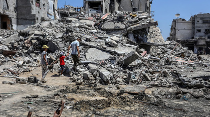 A Palestinian child walks among the rubble of homes destroyed by Israeli forces in northern Gaza.