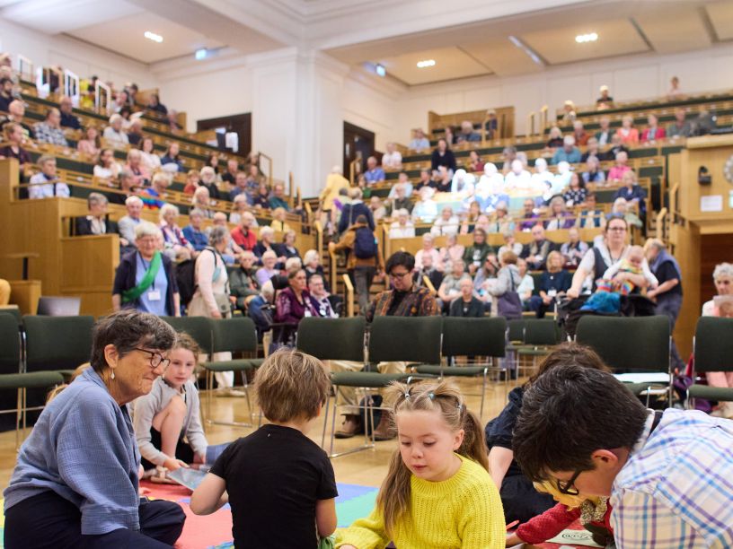 Large meeting for worship with children in foreground