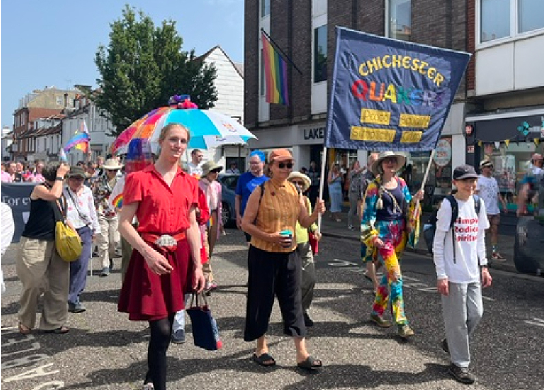 People walking with a banner