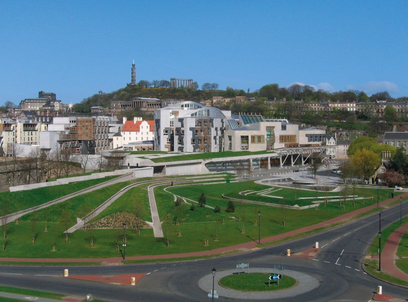 Modern building with Edinburgh skyline behind