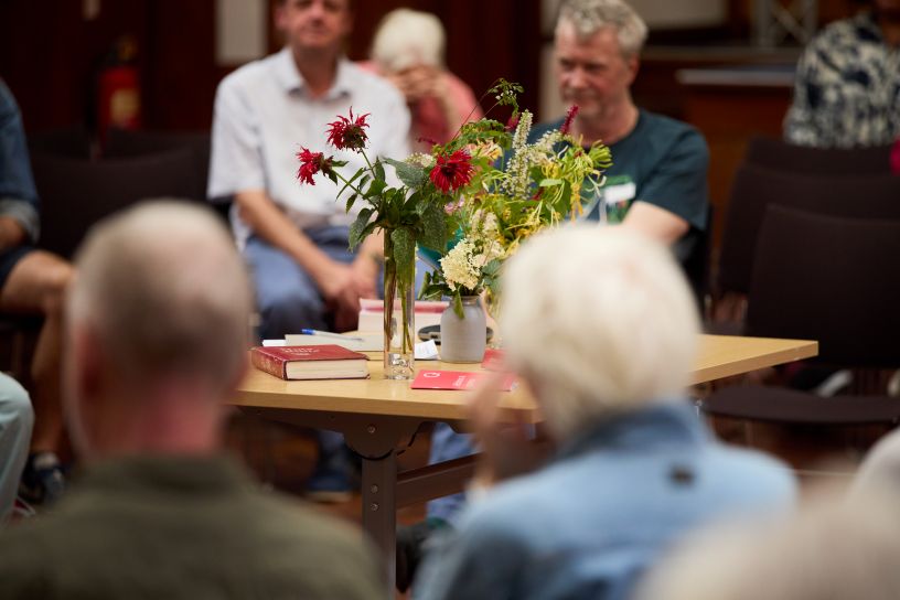 Flowers and QF&P red book on table