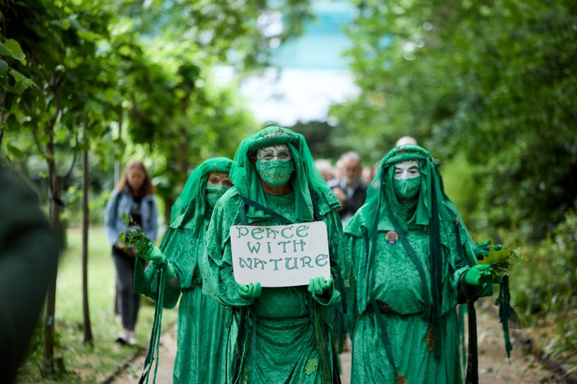 People dressed in green robes